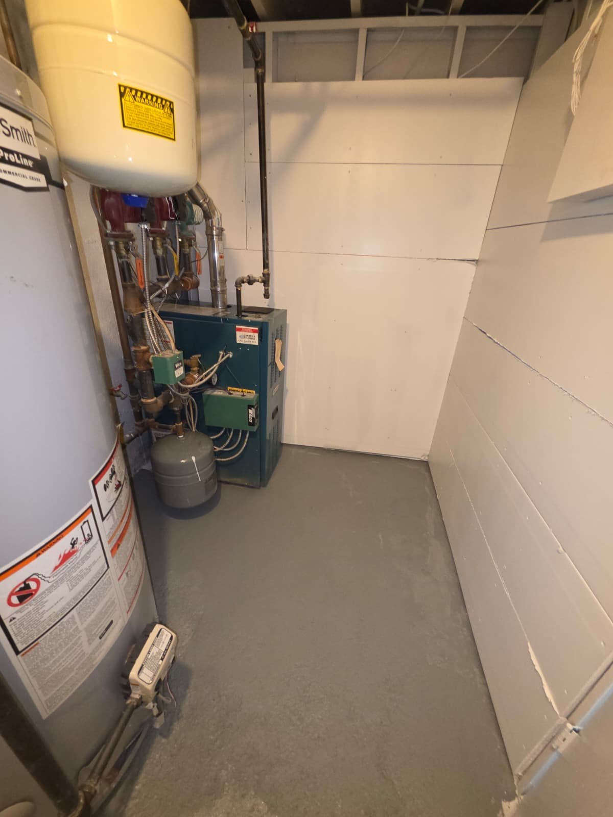 Clean utility room with boiler and water heater after mold remediation — Suffolk County NY